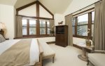 Master suite with king bed, flat screen TV, mountain views, and en-suite bathroom.